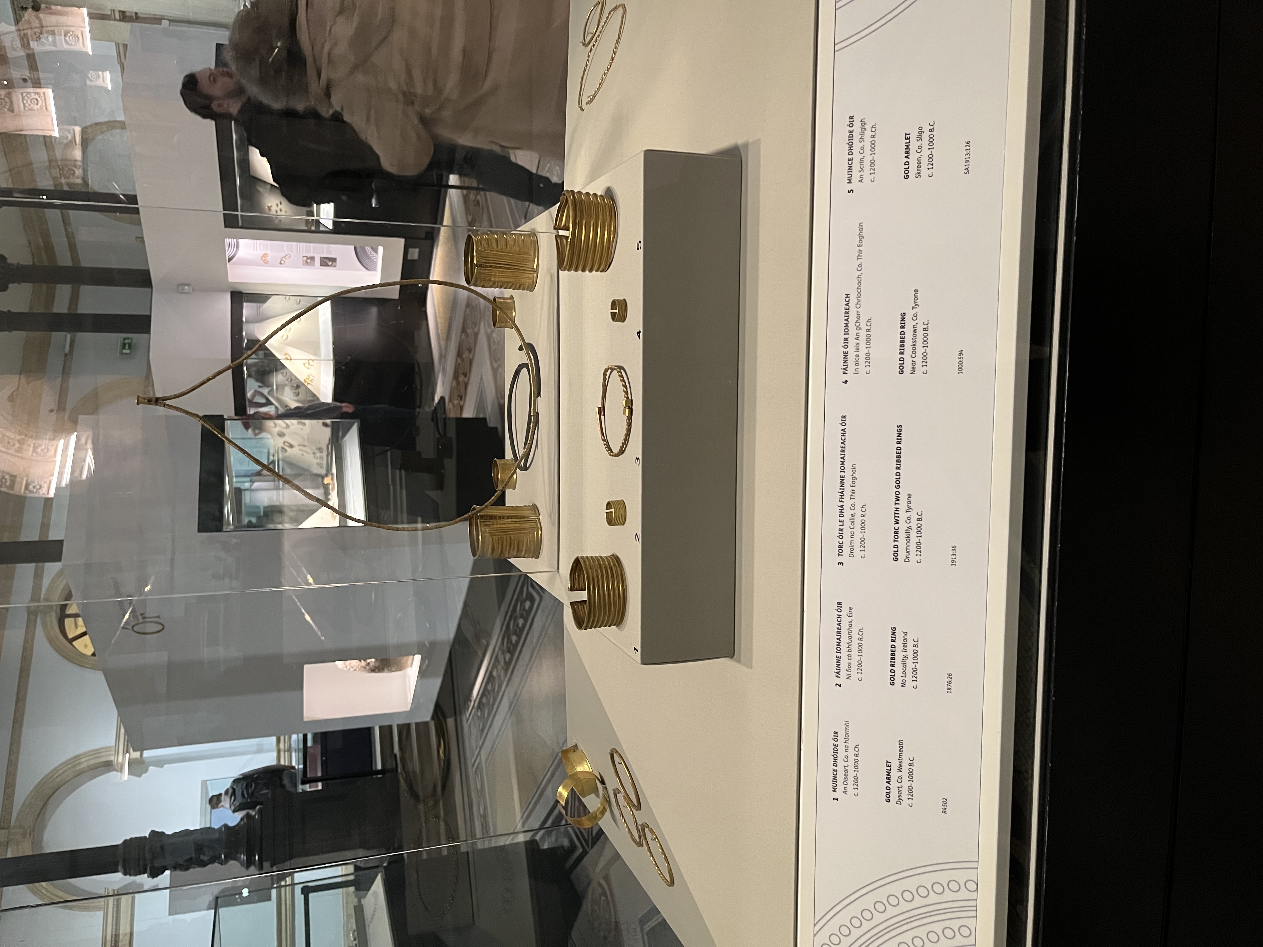Gold necklace and bracelets in a display case